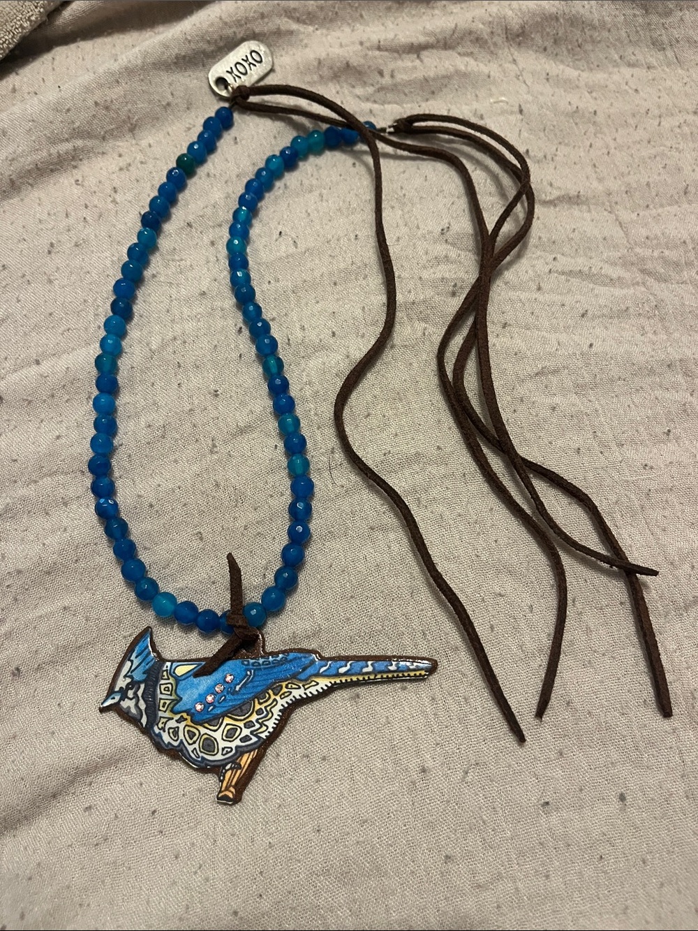 Xoxo bluejay bead, leather tie necklace